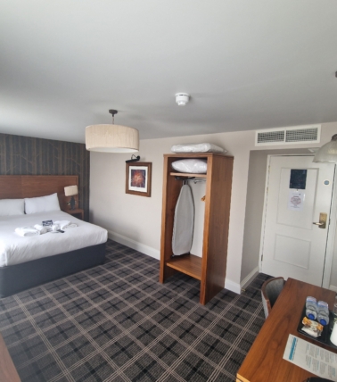 The Queen Hotel double room with wardrobe and desk