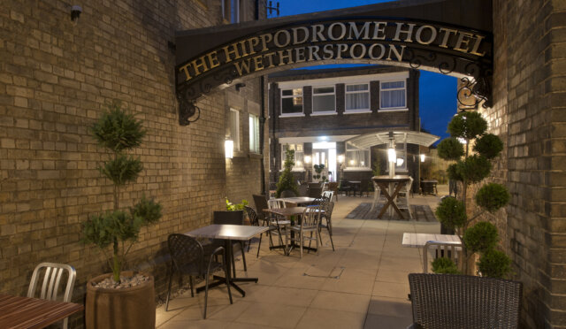 The Hippodrome, March outdoor seating with overhead signage