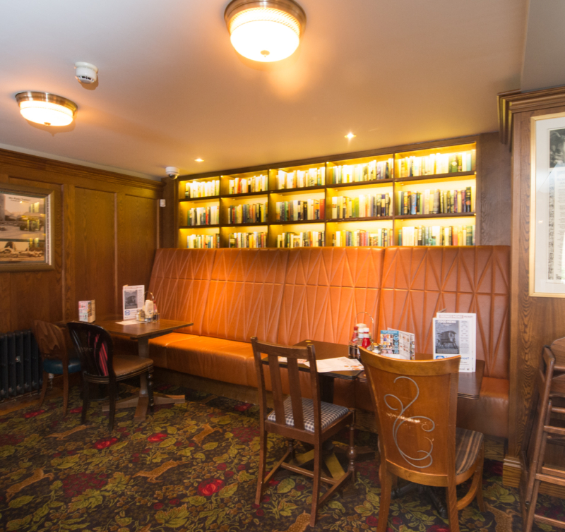 Dining area and bookcases in The Romany Rye Pub