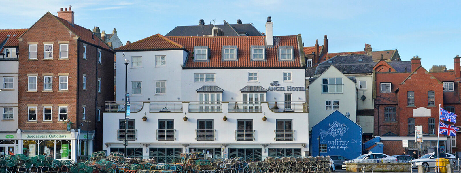 Exterior view of The Angel Hotel, Whitby, with wooden lobster nets out front