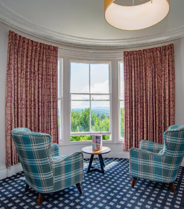 The Foley Arms, Great Malvern bedroom seating area with views of Malvern
