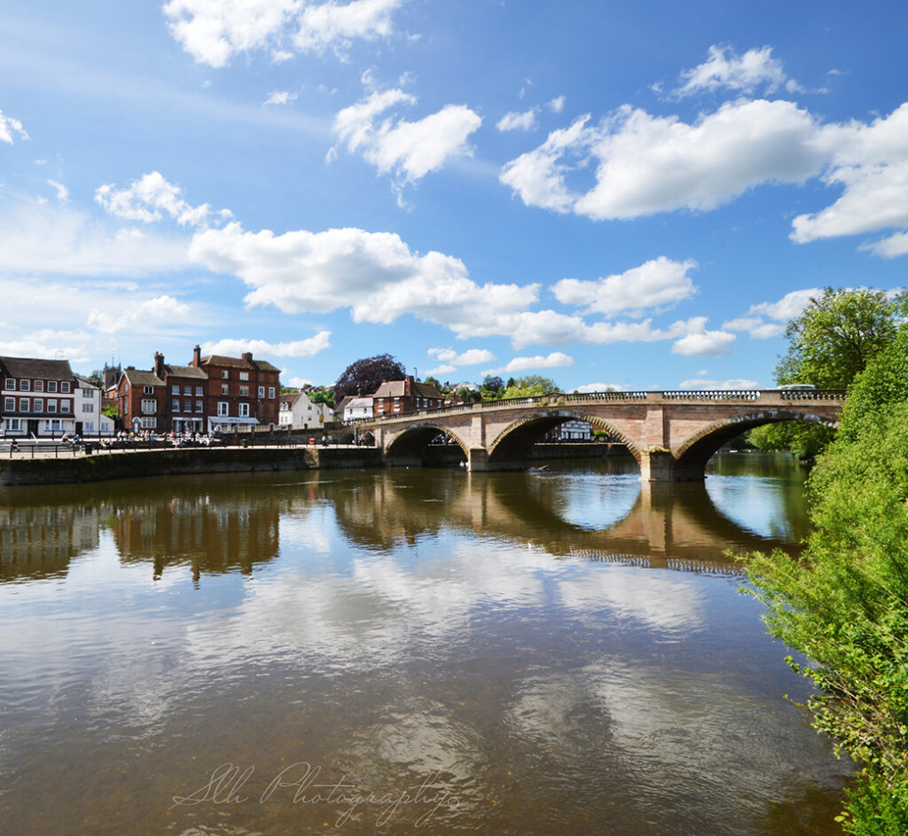 view of river, town and bridge in bewdley
