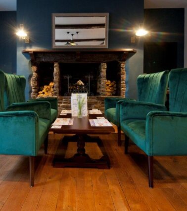The George Hotel, Brecon pub seating in front of fireplace