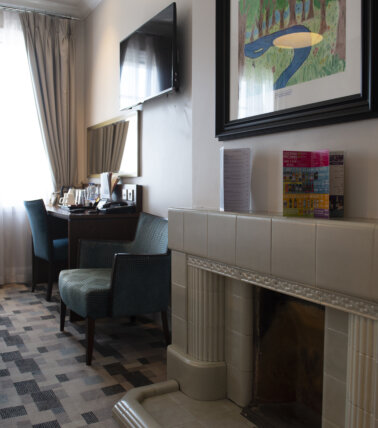 The Greenwood Hotel, Northolt room seating area and fireplace