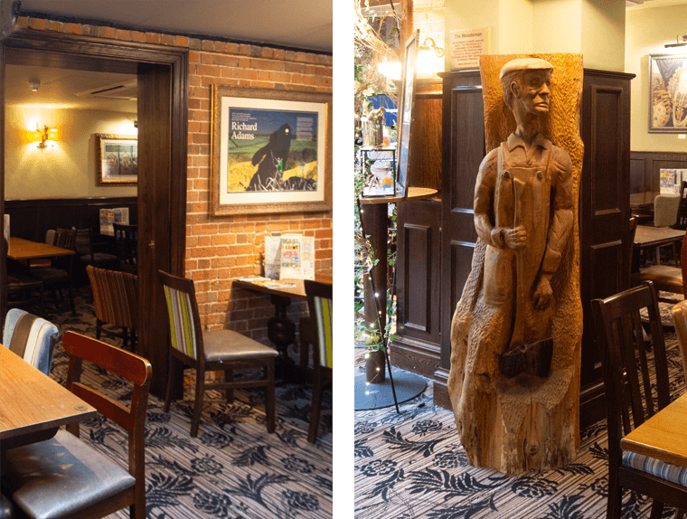 A wooden sculpture of a farmer with an axe in the pub at the Hatchet Inn