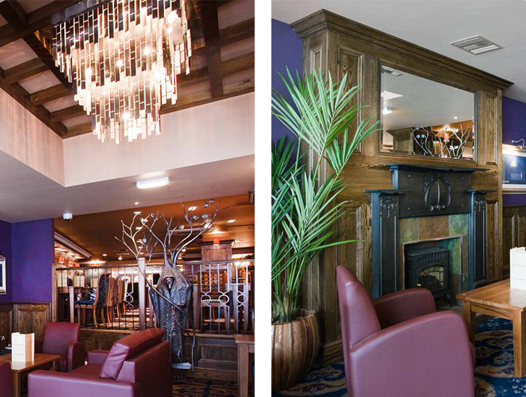 Chandelier, armchairs and fireplace in the White Lady pub