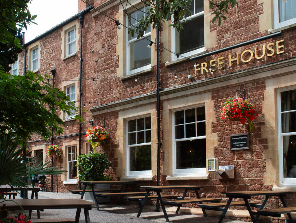 Freehouse sign and picnic tables outside the Duke of Wellington pub hotel