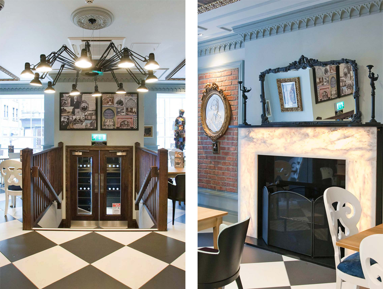 Entrance, dining area and marble fireplace with black and white checkered flooring at the Guildhall & Linen Exchange pub