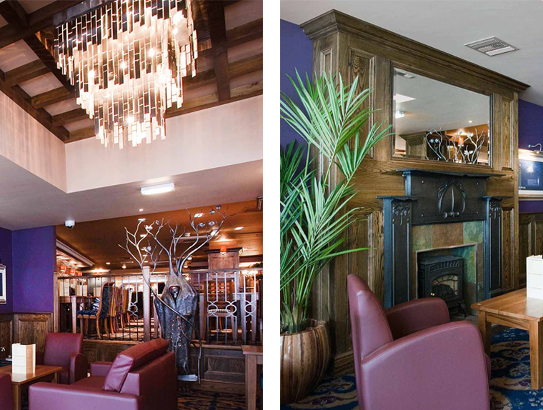Chandelier, armchairs and fireplace in the White Lady pub